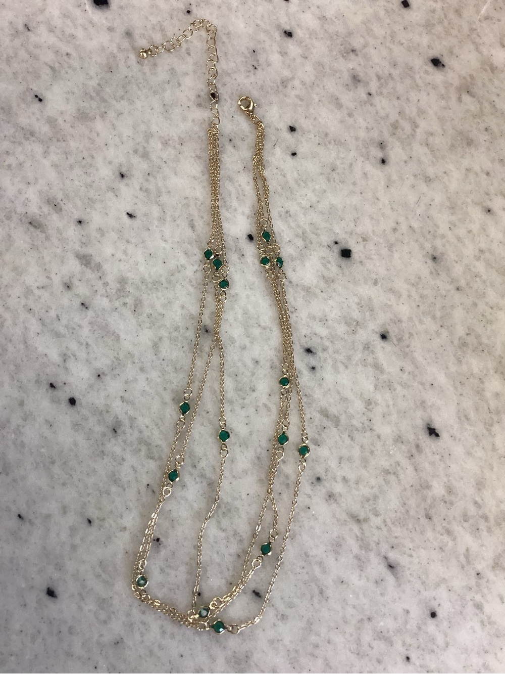 Gold Multi-Strand Necklace with Green Gem Accents